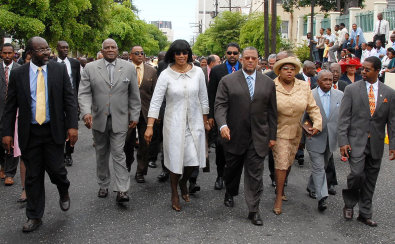 Prime Minister Portia Simpson Miller (centre), leads Members of Parliament for the Government towards Gordon House, before the State Opening of Parliament for the new financial year, 2007/08