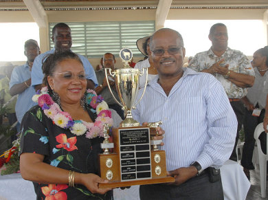 Governor General, His Excellency, the Most Honourable Professor Kenneth Hall presents trophy to Maria Azan, who was crowned Champion Farmer at the 2007 Denbigh Agricultural Show, held at the Denbigh Showgrounds in Clarendon