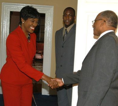 Governor General, His Excellency, the Most Hon. Professor Sir Kenneth Hall, (right) greets Executive Director of the Scientific Research Council (SRC), Dr. Audia Barnett, on her arrival at King's House on Oct 31, for the ceremony officially declaring November as Science and Technology Month. In the background, is Sir Kenneth's Aide-de-Camp, Captain Delando Coriah. The proclamation for Science and Technology Month was read by the Governor General.