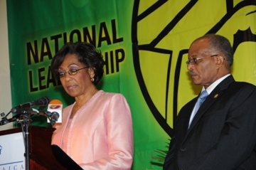 Her Excellency, the Most Hon. Rhmeia Hall, addressing the 29th annual Prayer Breakfast. At right is His Excellency, the Governor-General, the Most Hon. Professor Kenneth Hall.