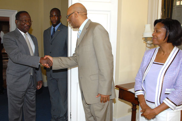 Governor-General, His Excellency the Most Hon. Dr. Patrick Linton Allen (second right), greets President of the Commonwealth of Dominica, His Excellency, Dr. Nicholas Liverpool (left), when he visited King's House on February 27. Also sharing in the moment are: Her Excellency the Most Hon. Mrs. Allen and the Governor-General's Aide-de-Camp, Delando Coriah. Dr. Liverpool's visit was the first courtesy call on the new Governor-General, who assumed office on February 26.