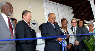 Governor-General, His Excellency the Most Hon. Professor Sir Kenneth Hall cuts the ribbon to officially open the Bustamante Museum, located at the former residence of the late National Hero, the Rt. Excellent Sir Alexander Bustamante, at 24 Tucker Avenue, Kingston 6, on February 3. Also participating in the ceremony (from left) are: Former Prime Minister, P. J. Patterson; Prime Minister Bruce Golding; Minister of Information, Culture, Youth and Sports, Olivia Grange; Former Prime Minister, Edward Seaga; wife of the President of the Senate, Marigold Harding, and Curator of the museum, Nora Strudwick. The museum houses an eclectic collection of Bustamante memorabilia and a permanent multimedia exhibition.