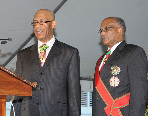 Governor General His Excellency the Most Hon. Dr. Patrick Allen (left) takes theOath of Office as the sixth Governor General of Jamaica, during the swearing-in ceremony on the lawns of King's House today (Feb. 26). Looking on is his predecessor, His Excellency the Most Hon. Professor Sir Kenneth Hall.