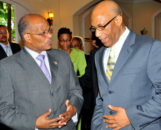 Governor General of Jamaica, His Excellency, the Most Honourable, Dr. Patrick Allen, (right) converses with former Governor General, the Most Honourable Professor Sir Kenneth Hall during the Governor General's Achievement Awards Scheme luncheon held at the Terra Nova All Suite Hotel in Kingston on March 25.