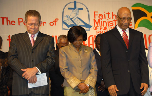 Their Excellencies, Governor-General, the Most Hon. Dr. Patrick Allen (right); the Most Hon. Mrs. Allen (centre) and Prime Minister Bruce Golding participate in a worship session at the Prayer and Restorative Service, held at the National Arena on March 4. The service was held under the theme: ‘Heal the Family, Heal the Nation’.