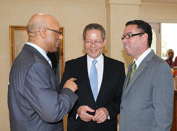 Governor-General, His Excellency the Most Hon. Dr. Patrick Allen (left), shares a light moment with Prime Minister Bruce Golding (centre), and Minister of State in the Office of the Prime Minister, and Member of Parliament for West Portland, Daryl Vaz, following a brief ceremony at King's House, on April 1, during which Mr. Vaz was sworn into office.