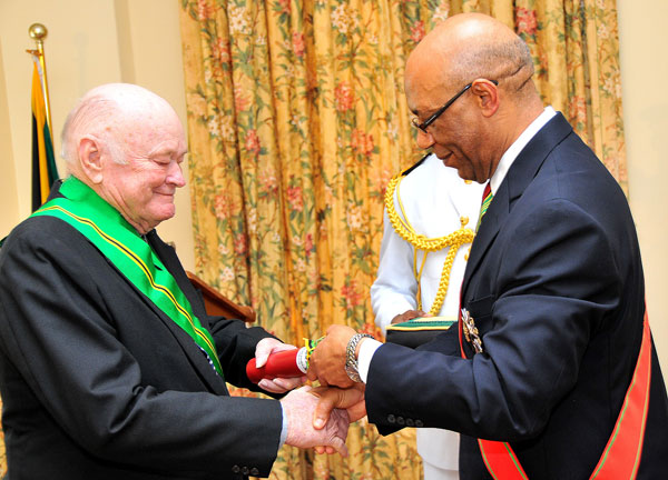 Governor-General, His Excellency the Most Hon. Dr Patrick Allen (right), confers the Order of Jamaica (OJ), on Businessman, Desmond Blades, for his contribution to Jamaica’s economy. Mr. Blades was honoured during a special ceremony of investiture, at King’s House, on May 12.