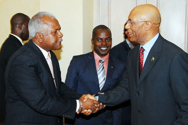 Governor-General, His Excellency the Most Hon. Sir Patrick Allen (right) shakes hands with National Director of the National Transformation Programme (NTP), Rev. Al Miller, during the launch of the NTP, branded Fresh Start Jamaica, at King's House Wednesday (July 29). Looking on is Director of Development and Planning for the NTP, Fabian Brown.