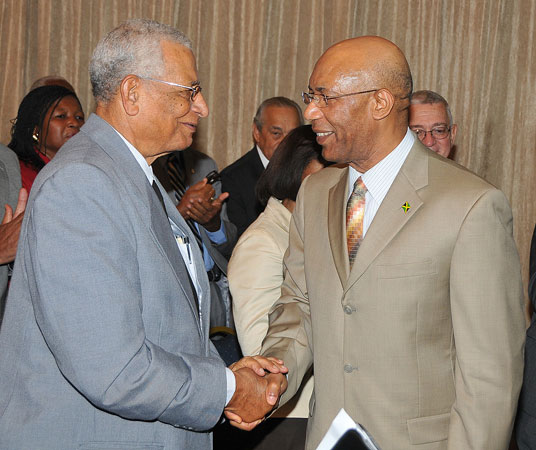 Governor-General, His Excellency the Most Hon. Sir Patrick Allen (right), is greeted by Custos of Kingston, Rev. Canon, the Hon. Weeville Gordon, when he arrived at the Jamaica Pegasus Hotel, in Kingston, today (September 9), for a meeting with Canon Gordon, Justices of the Peace (JPs) from Kingston, and members of the Kingston Chapter of the Lay Magistrates' Association of Jamaica.