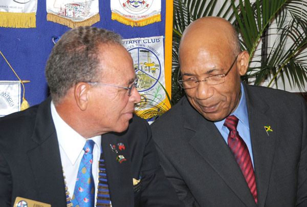 Governor-General, His Excellency the Most Hon. Sir Patrick Allen (right), converses with District Governor of the Rotary Club of Liguanea Plains, Mr. Errol Alberga, during a Club meeting, held at Eden Gardens, in Kingston, on September 10. The Governor-General  was inducted as an Honorary Rotarian. 