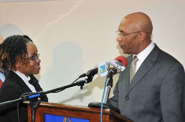 The Governor-General, His Excellency the Most Hon. Sir Patrick Allen, congratulates Alecia John who was named as the 2010 Rhodes Scholar during a ceremony held Friday (November 20) at King's House, Kingston.