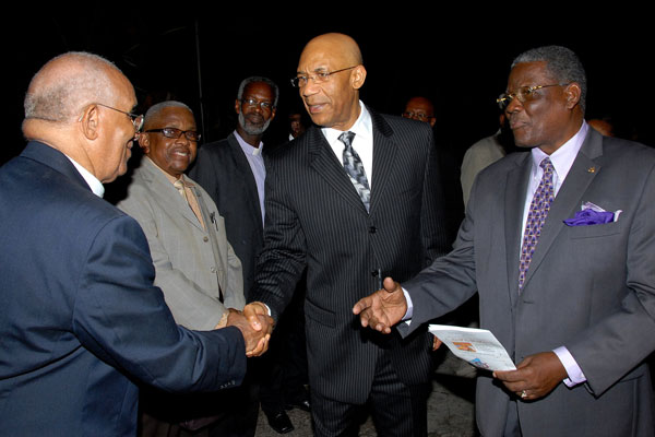 Governor-General, His Excellency the Most Hon. Sir Patrick Allen (second right), is introduced to Rev. Glenn Prince (left), member of the St. Ann's Bay Ministers Fraternal, by Custos of St. Ann, Hon Radcliffe Walters(right), when he arrived for the annual National Prayer Vigil, held at the St. Ann's Bay Baptist Church on December 13.