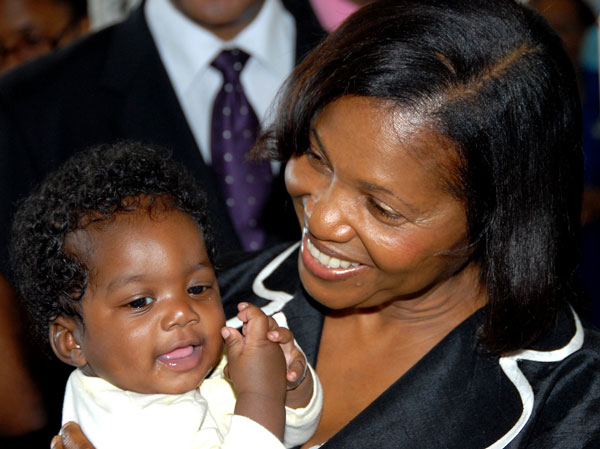 Wife of the Governor-General, Her Excellency the Most Hon. Lady Allen, cuddles four-month-old patient at the Bustamante Hospital for Children, Ottavio Green, during a visit to the institution, located in Kingston, on December 21. Also visiting the hospital was Governor-General, His Excellency the Most Hon. Sir Patrick Allen, as part of a series of tours to four hospitals during the Christmas season.