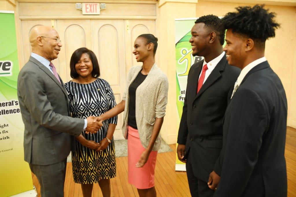 Their Excellencies Sir Patrick Allen and Lady Allen congratulate the top three winners in the 2017 I Believe Initiative Summer Of Service Competition. L-R: Ms. Leneka Rhoden (1 st ), Mr. Vashawn Saxton (2 nd ) and Mr. Timothy Simmonds (3rd ).