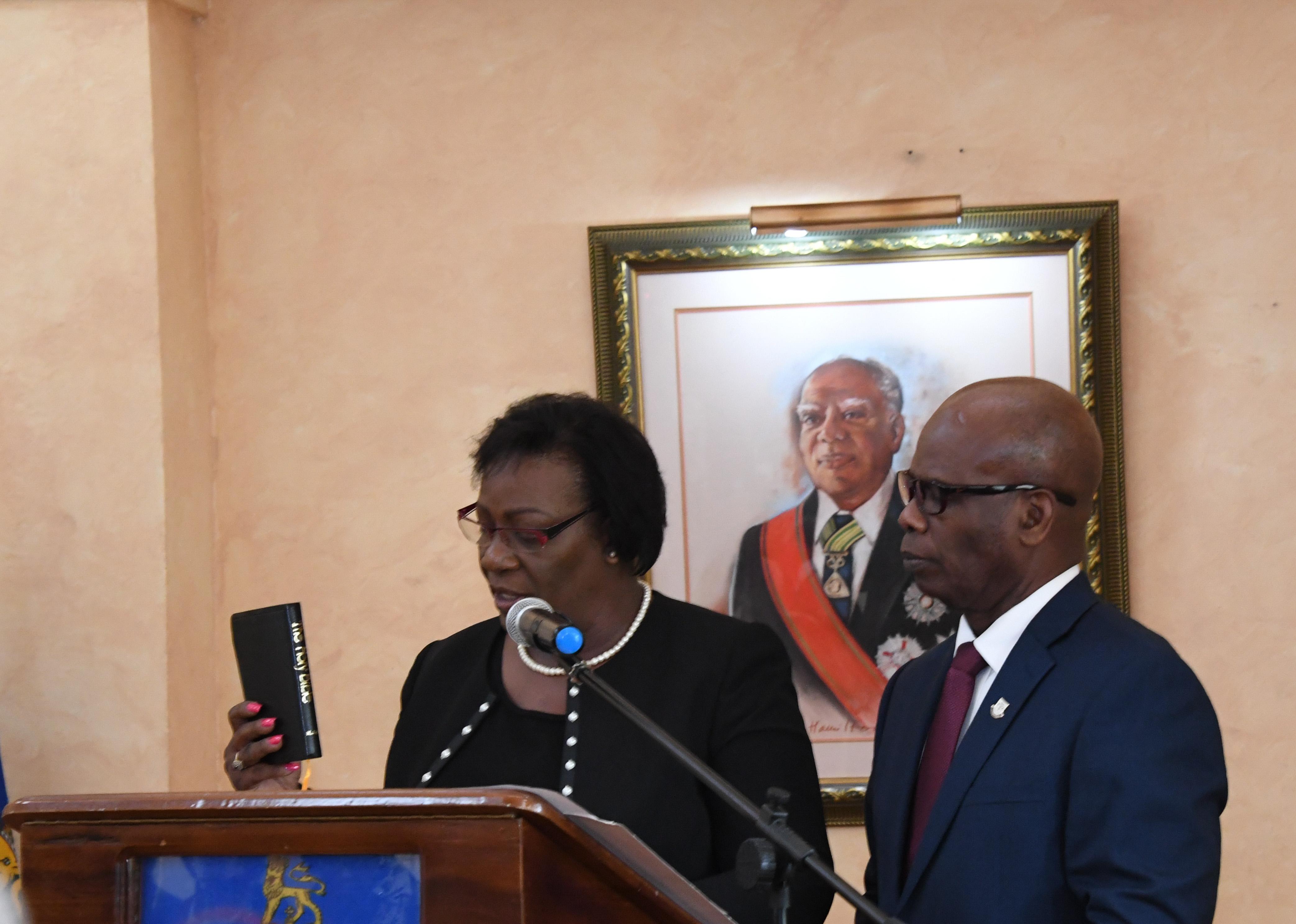 Deputy Governor-General the Honourable Steadman Fuller observes as Her Honour Ms. Judith A. Pusey takes her Oath of Allegiance and Judicial Oath during the swearing-in ceremony at King’s House on January 5. 